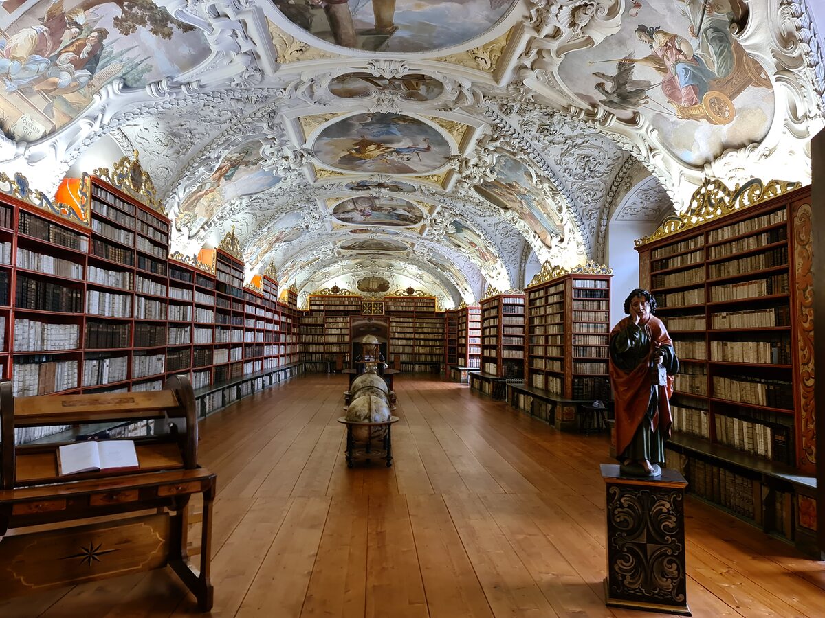The painted Theological Hall of the Strahov Monastery library with its frescoed ceiling and wooden bookcases