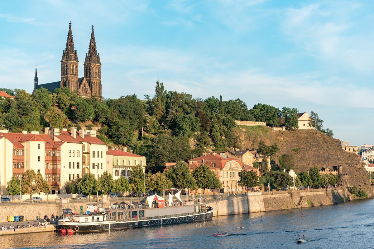 Vysehrad hill above the Vltava, the twin spires of Saints Peter and Paul and the embankment below