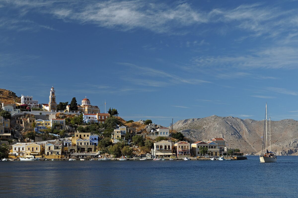The hillside village of Chorio on Symi, its pastel houses and churches stacked above the harbor