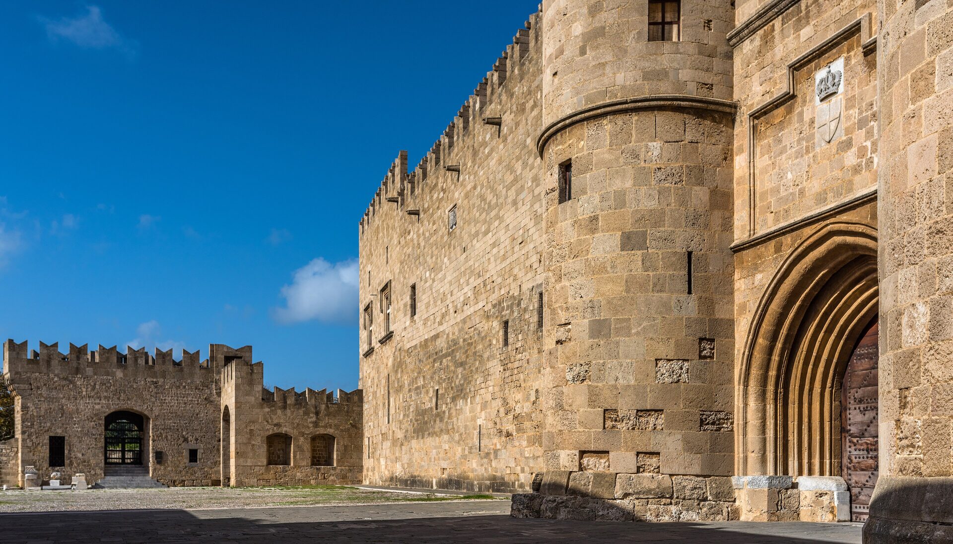 The Palace of the Grand Master and a stretch of the medieval walls in the Old Town of Rhodes
