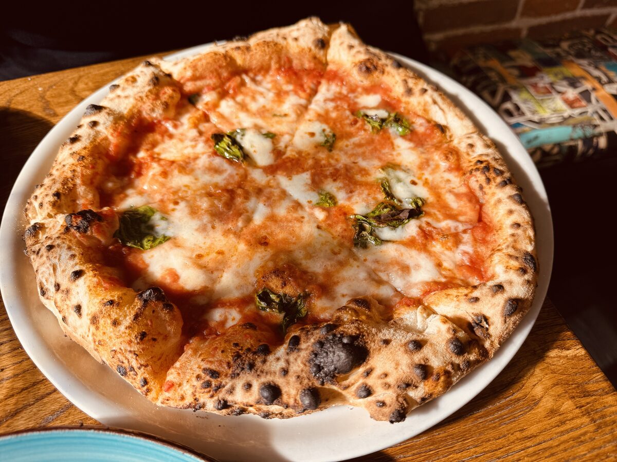 A Margherita pizza with basil