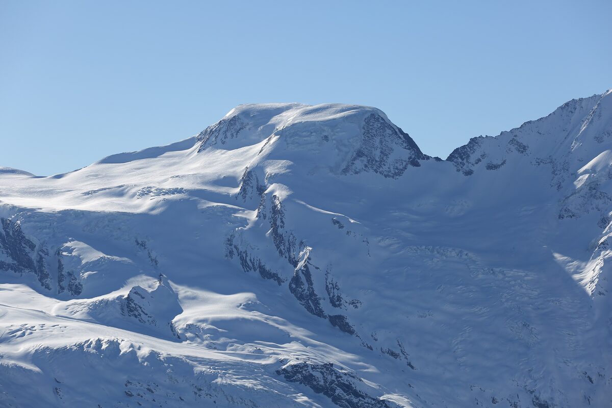 Snowy glacier peaks of the Alphubel group seen from the Hohsaas viewpoint