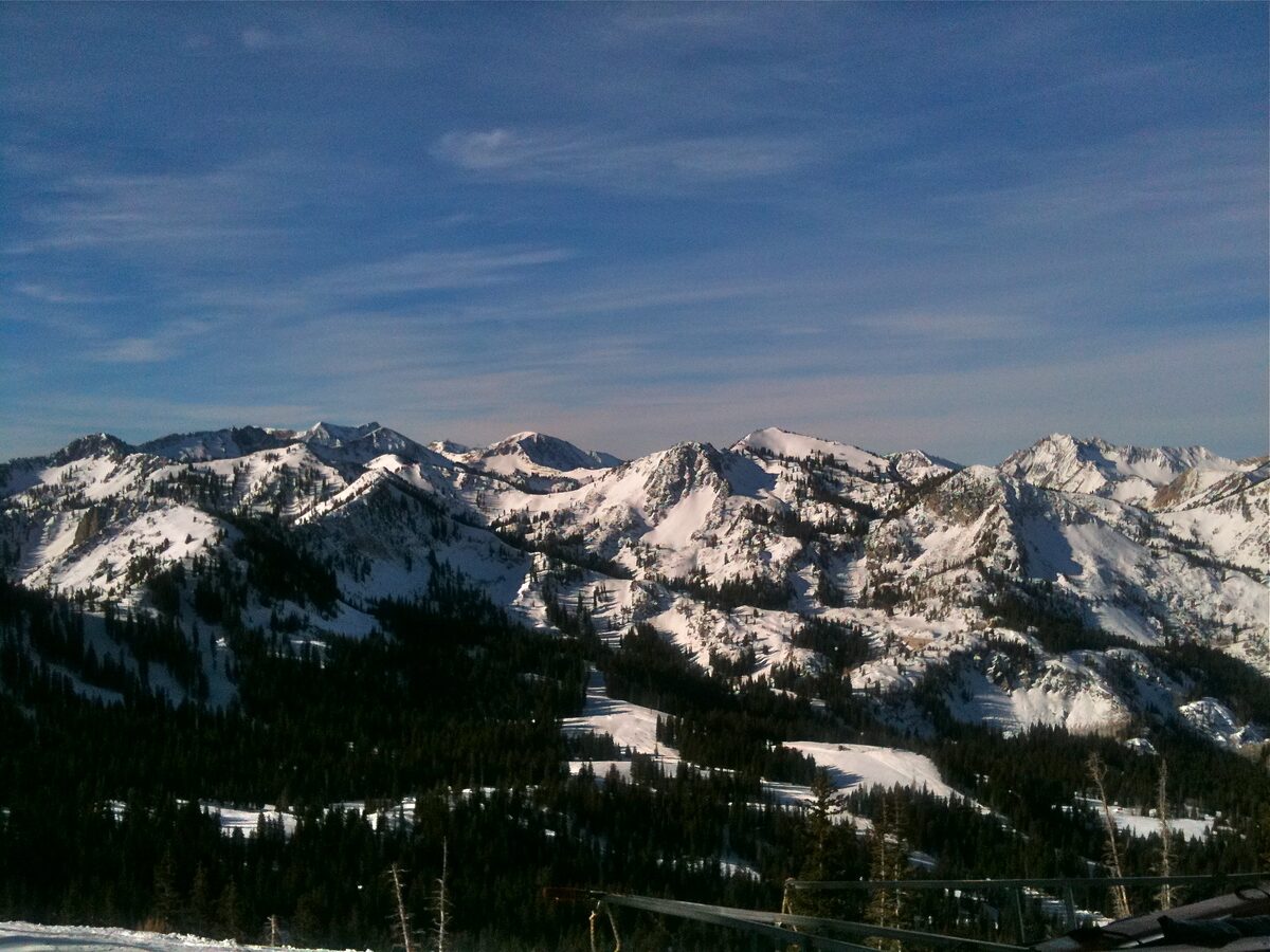 The snow-dusted peaks above Brighton and Big Cottonwood Canyon seen from the slopes