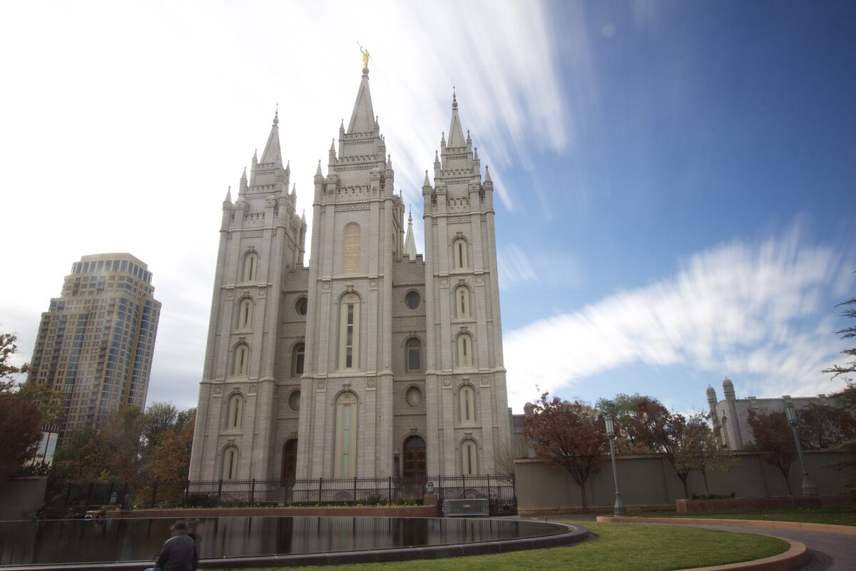 The three granite spires of the Salt Lake Temple rising above the reflecting pool on Temple Square