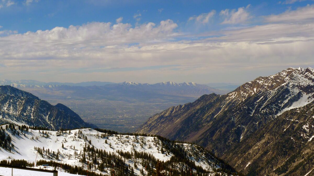 Snowy ridges at the top of Snowbird looking out over the haze of the Salt Lake Valley