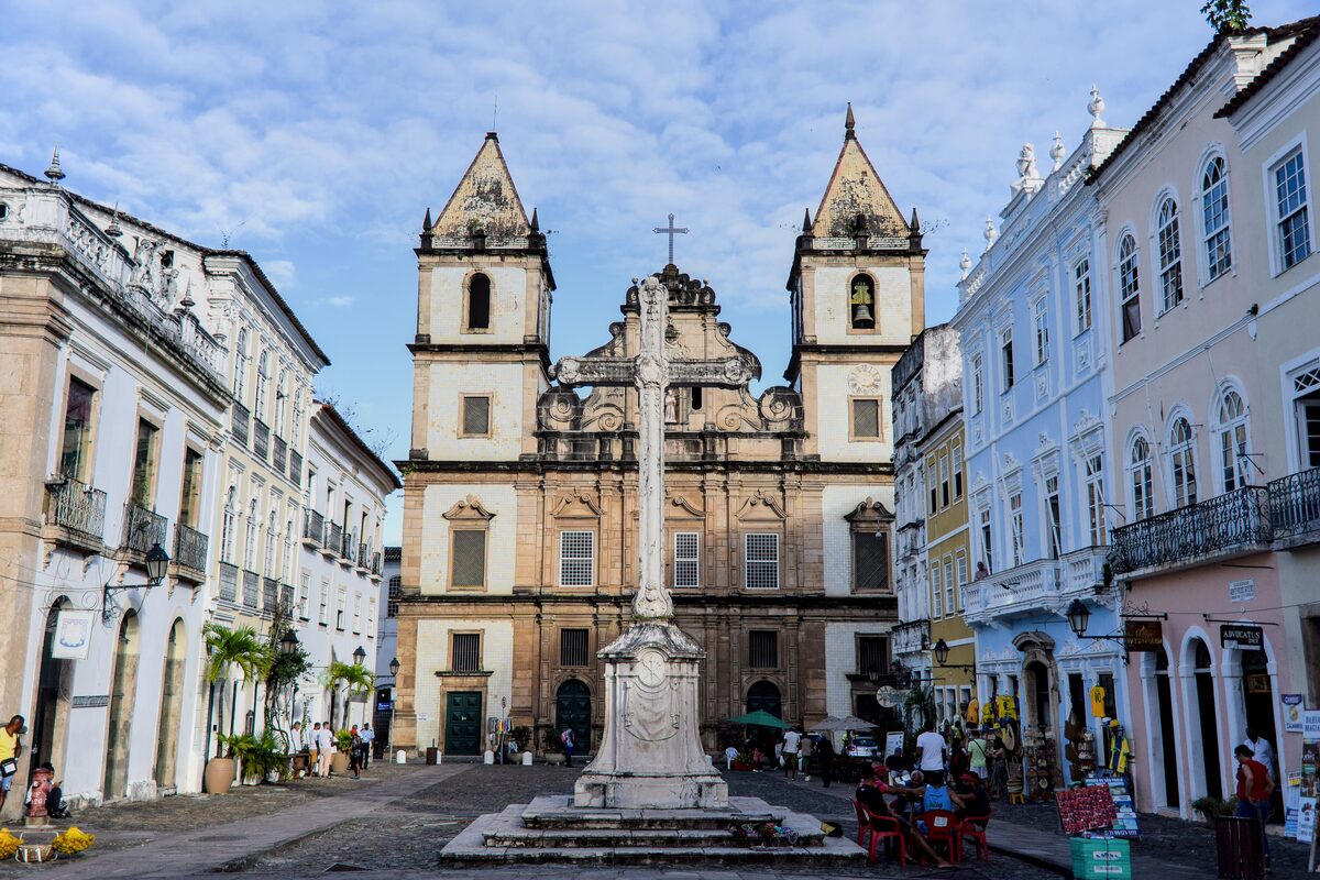 The twin-towered Church and Convent of São Francisco behind a stone cross on its square in Pelourinho