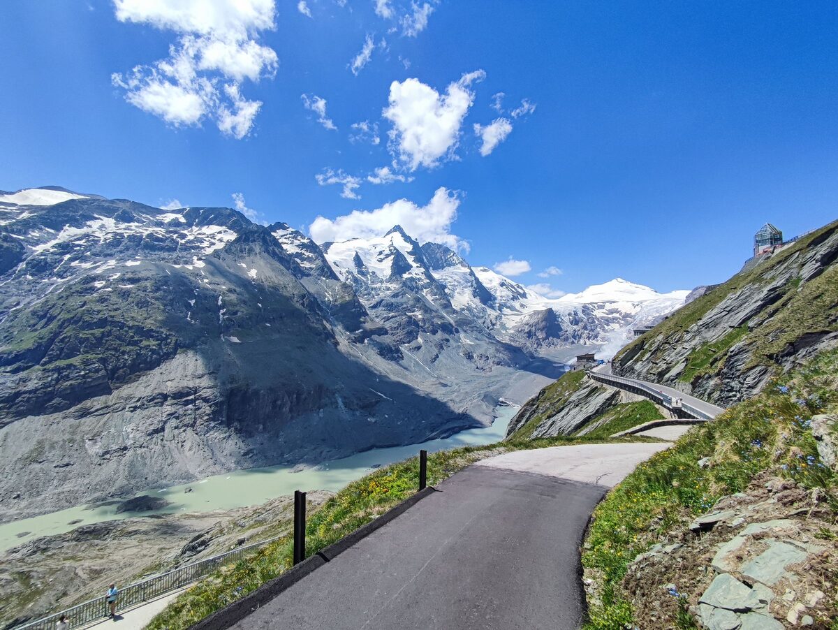 A road above the valley of the Pasterze glacier, with the snowy Grossglockner peak behind