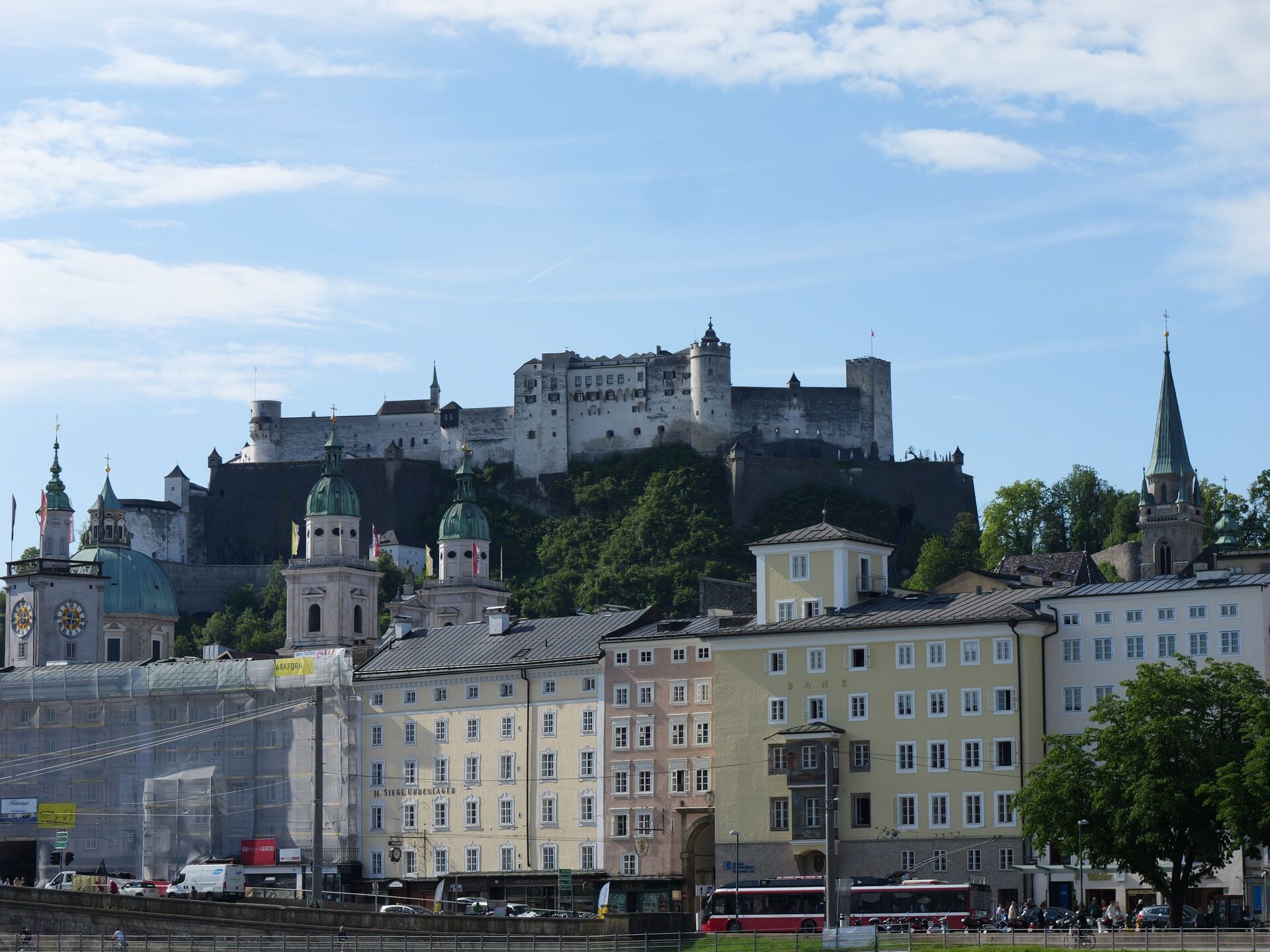 Hohensalzburg Fortress on its hill above the domes and towers of Salzburg's old town, seen from across the Salzach