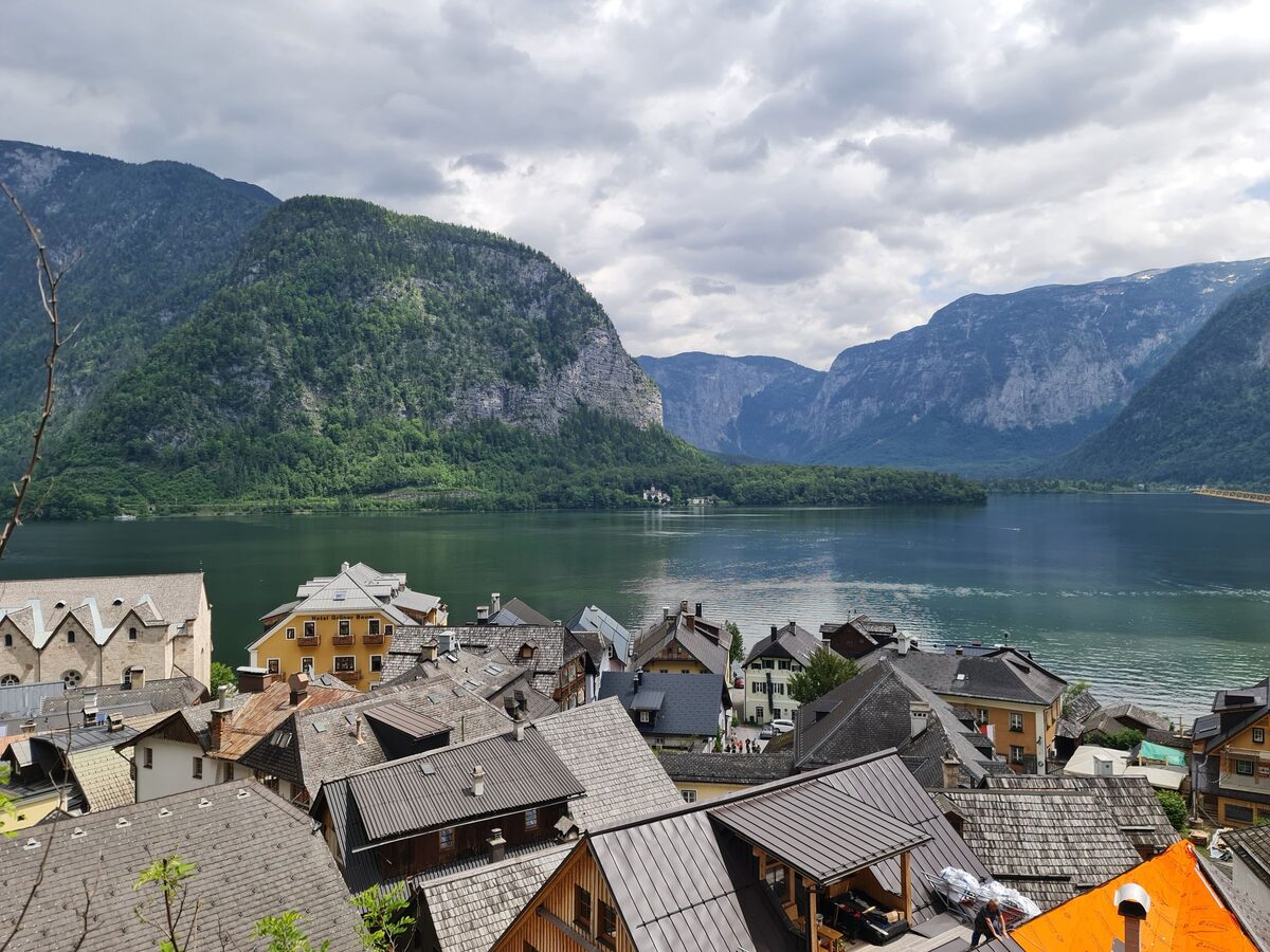 The roofs of Hallstatt seen from above, with the lake and steep mountains beyond