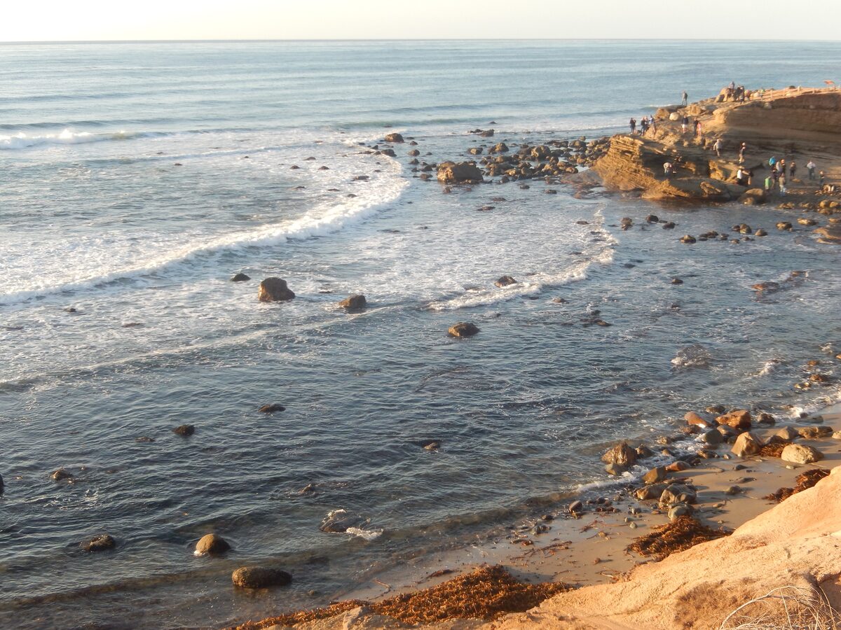 Waves washing over the rocky tide pool shelf at Cabrillo National Monument