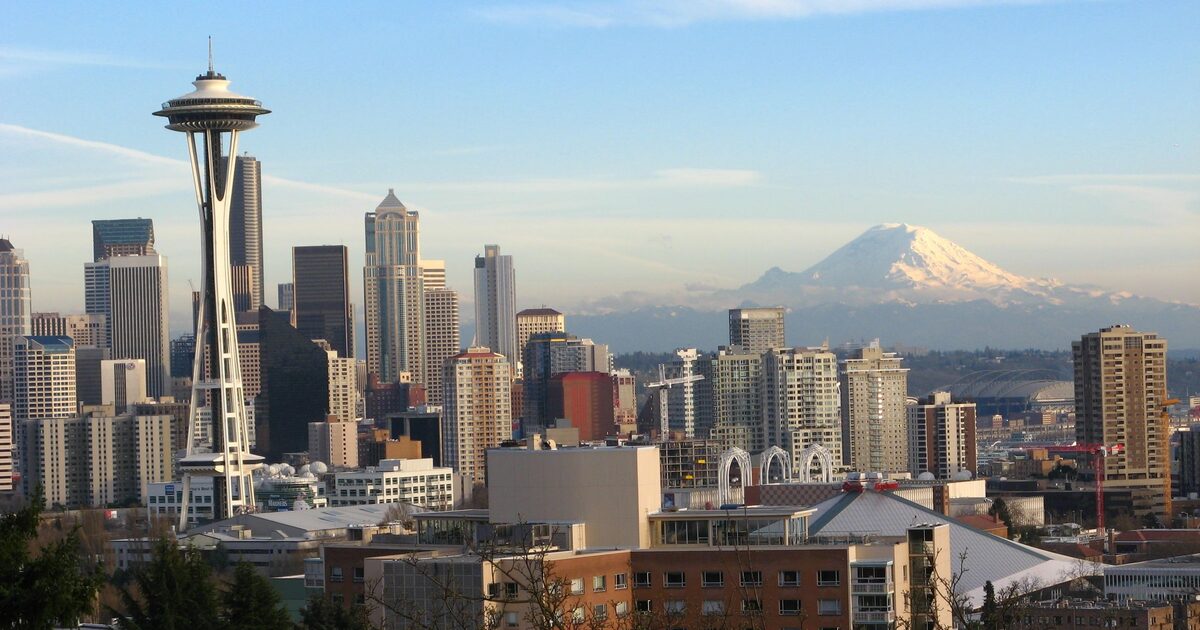 Seattle skyline with the Space Needle and Mount Rainier at sunset