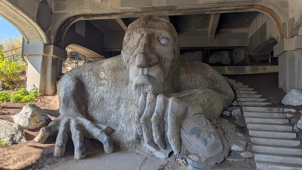 The Fremont Troll sculpture crouching under the Aurora Bridge