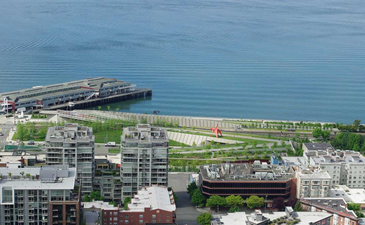 Green terraces of Olympic Sculpture Park beside Elliott Bay, seen from above