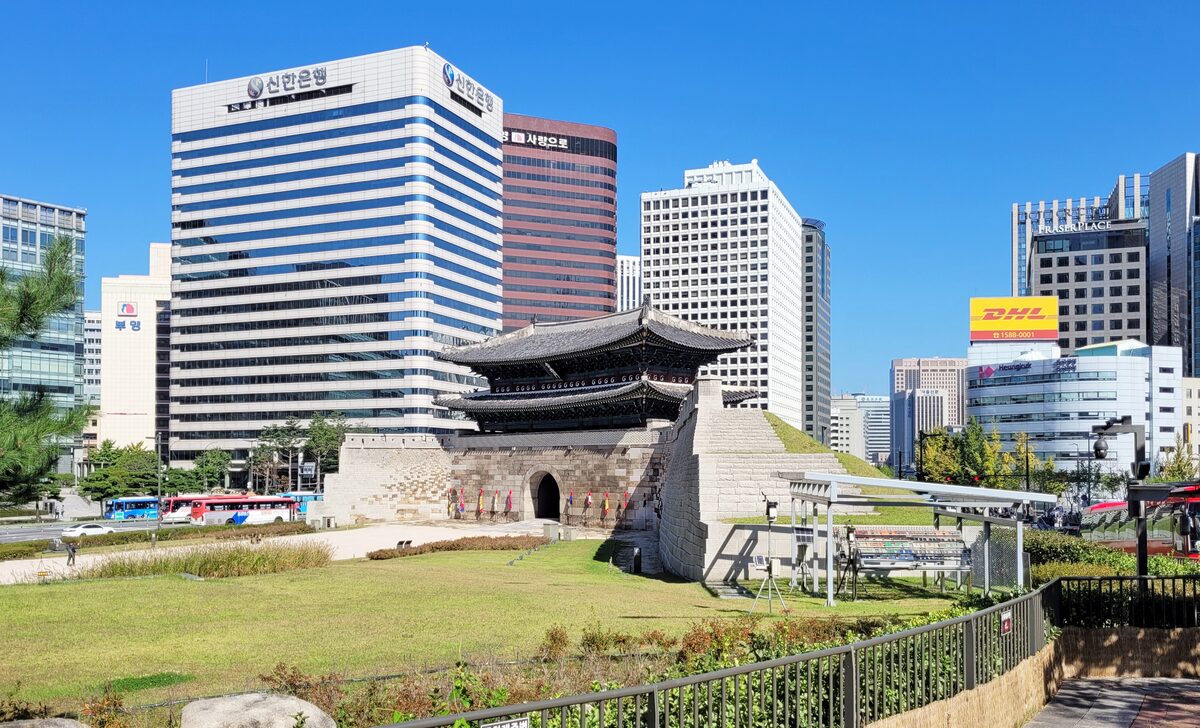 Sungnyemun, the Namdaemun gate, with its tiled roof in front of modern office towers