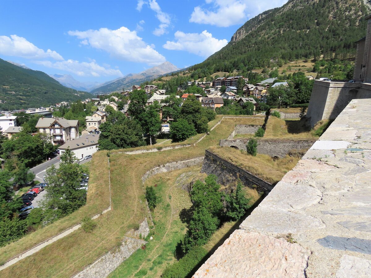 Briançon's Vauban ramparts with a grassy slope falling to the town below