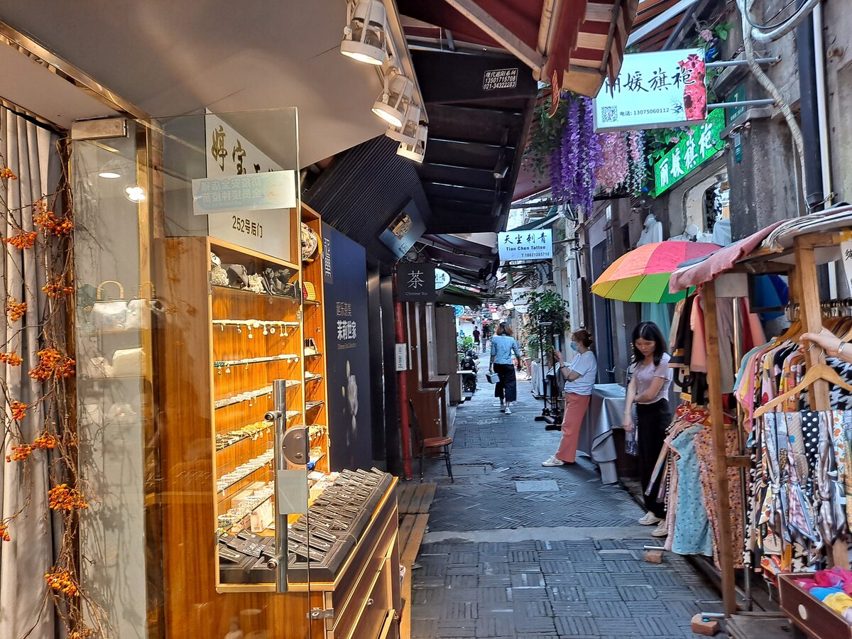 A narrow lane of small shops and market stalls in Tianzifang