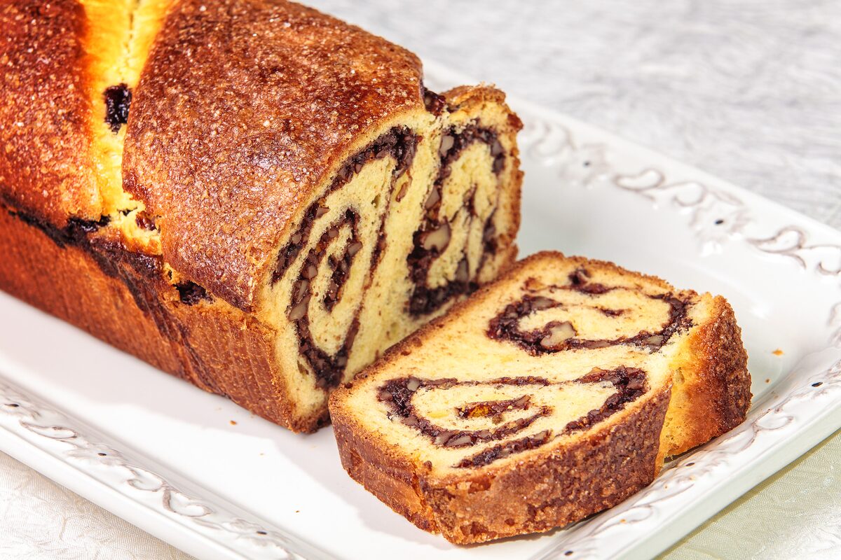 Slices of cozonac with a dark swirl of walnut and cocoa filling