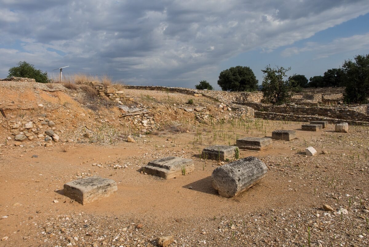 Stone foundations and fallen column drums of the bouleuterion, the council hall at ancient Olynthos