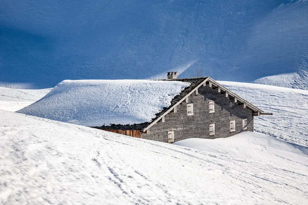 An old stone alp hut, the Batzen alp above Schröcken, under deep snow
