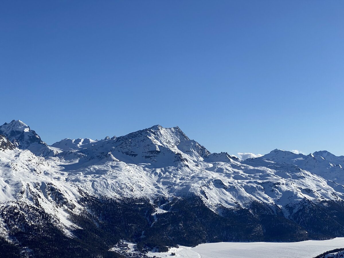 Snowy peaks and ridges seen from the Corviglia ski area on a clear winter day