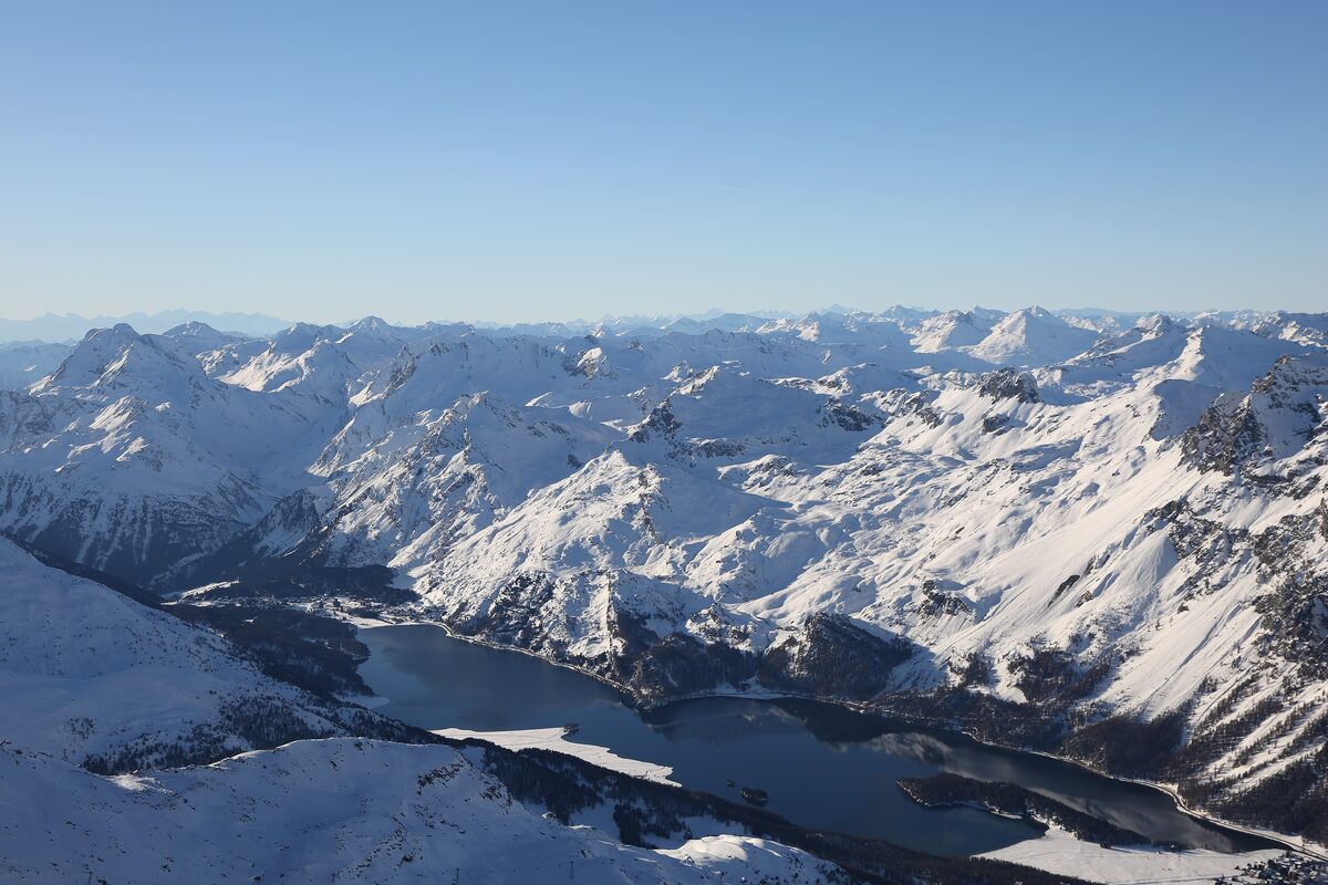 Lake Sils and the snowy Engadin peaks seen from Corvatsch in December