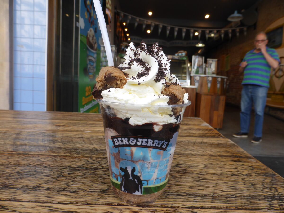 A Ben and Jerry's sundae in a cup with whipped cream