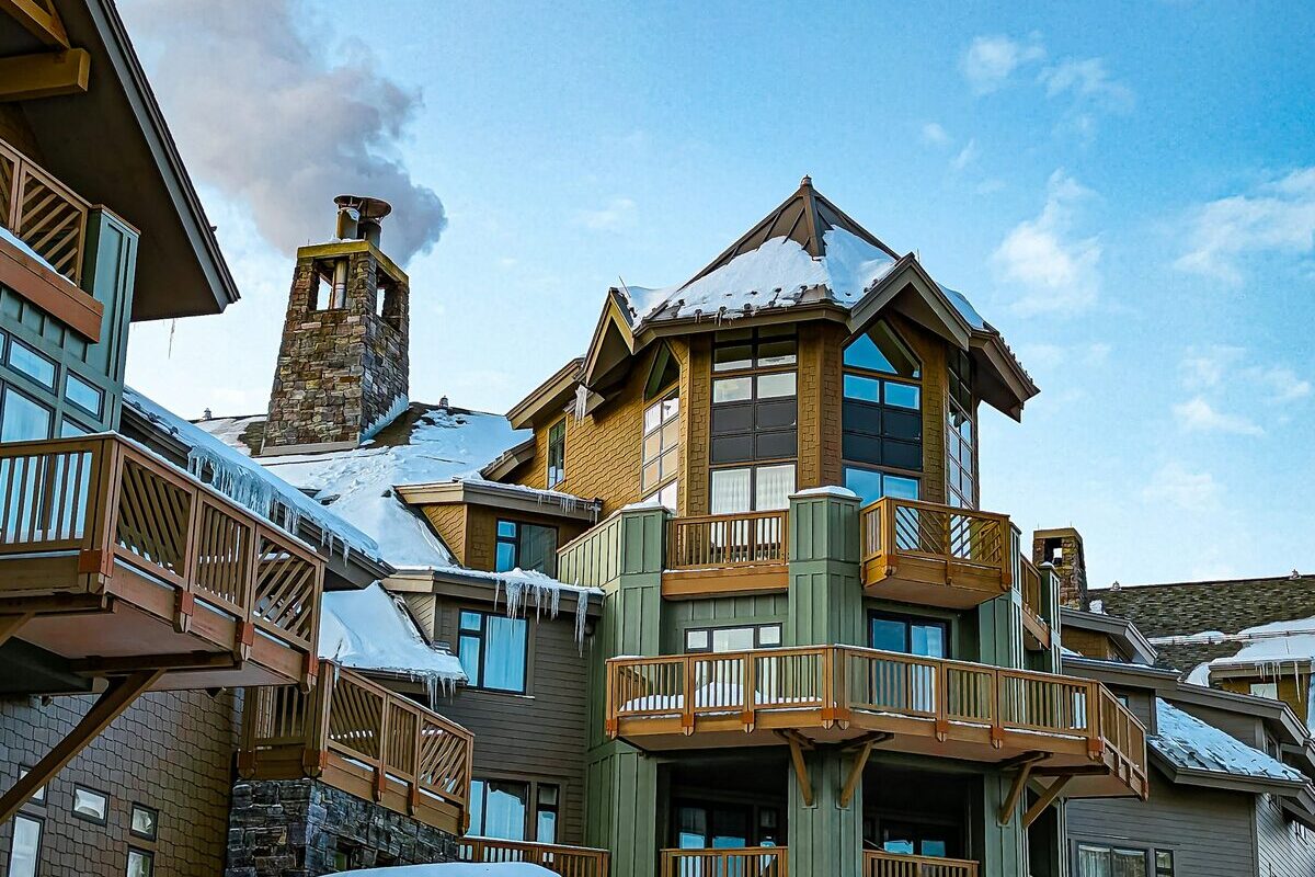 Snowy timber and stone lodge buildings in Stowe