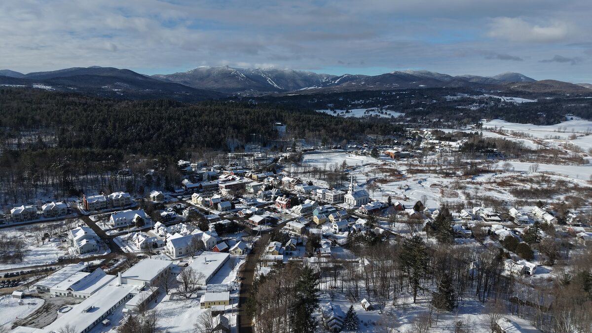 Aerial winter view of Stowe village with Mount Mansfield behind