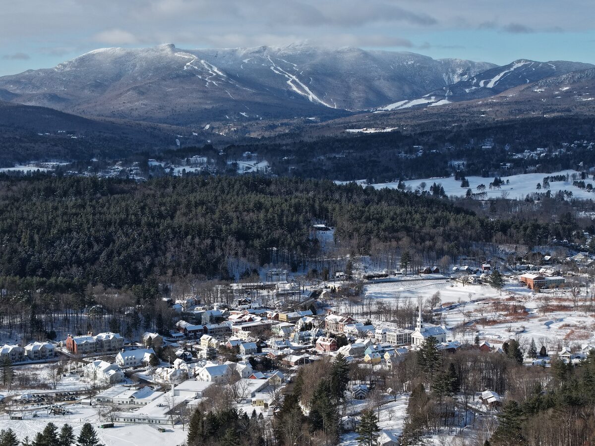 Winter view of Stowe village below snowy Mount Mansfield