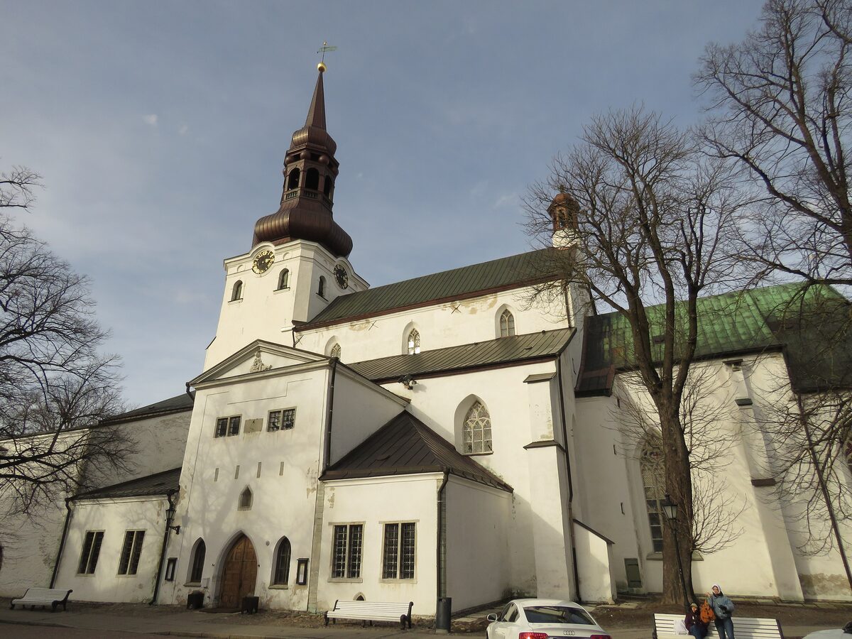 The white Gothic facade and tower of the Dome Church on Toompea hill