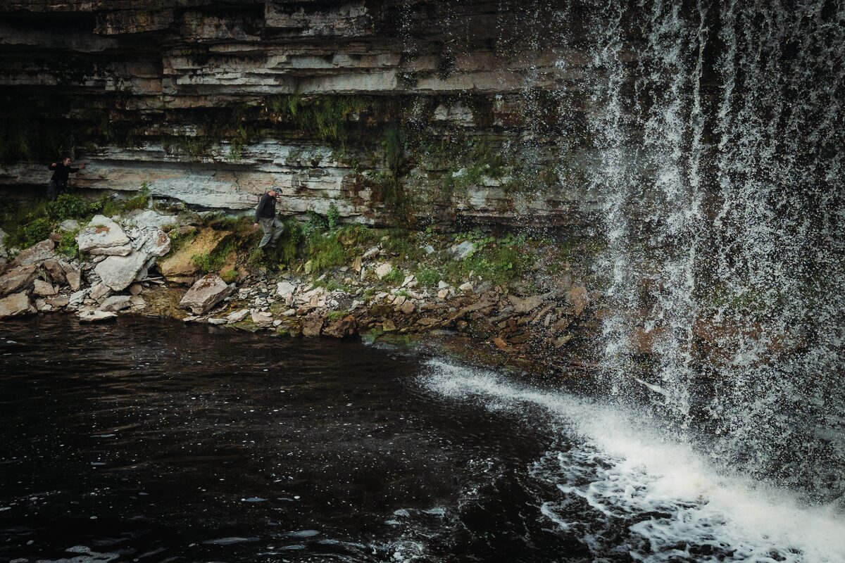 Water pouring over a limestone ledge at the Jägala Waterfall