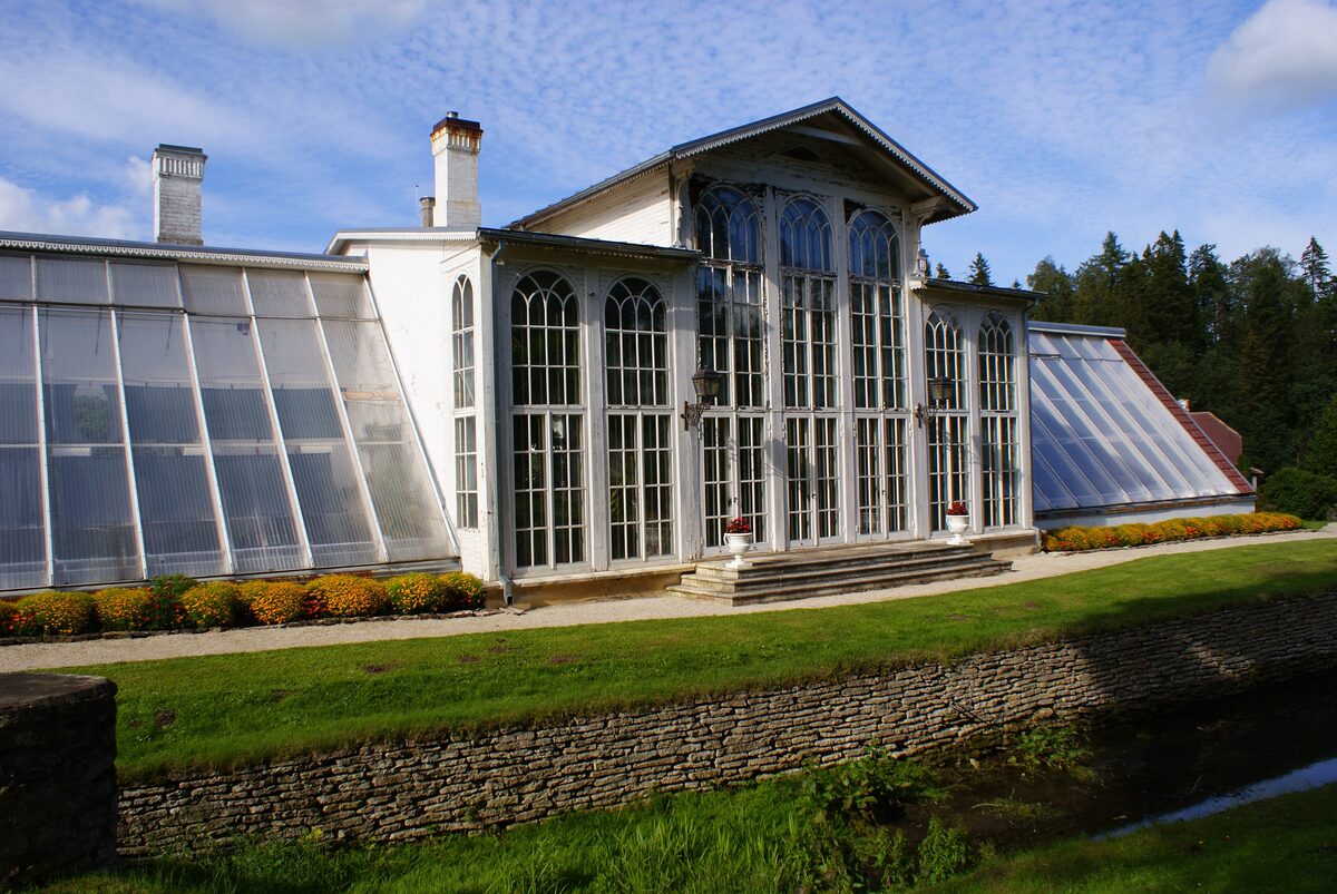 The glass palm house, a greenhouse wing of Palmse Manor, above a stone terrace
