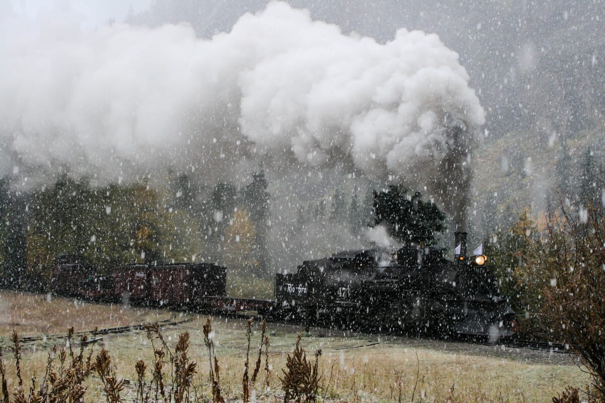 A steam train of the Durango and Silverton railroad in falling snow