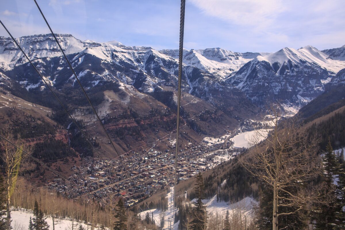 Gondola cables over the town of Telluride in its snowy box canyon