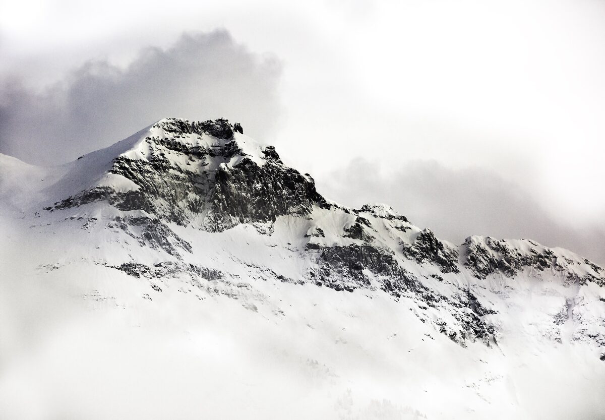 A snowy rocky peak under cloud in the San Juan Mountains