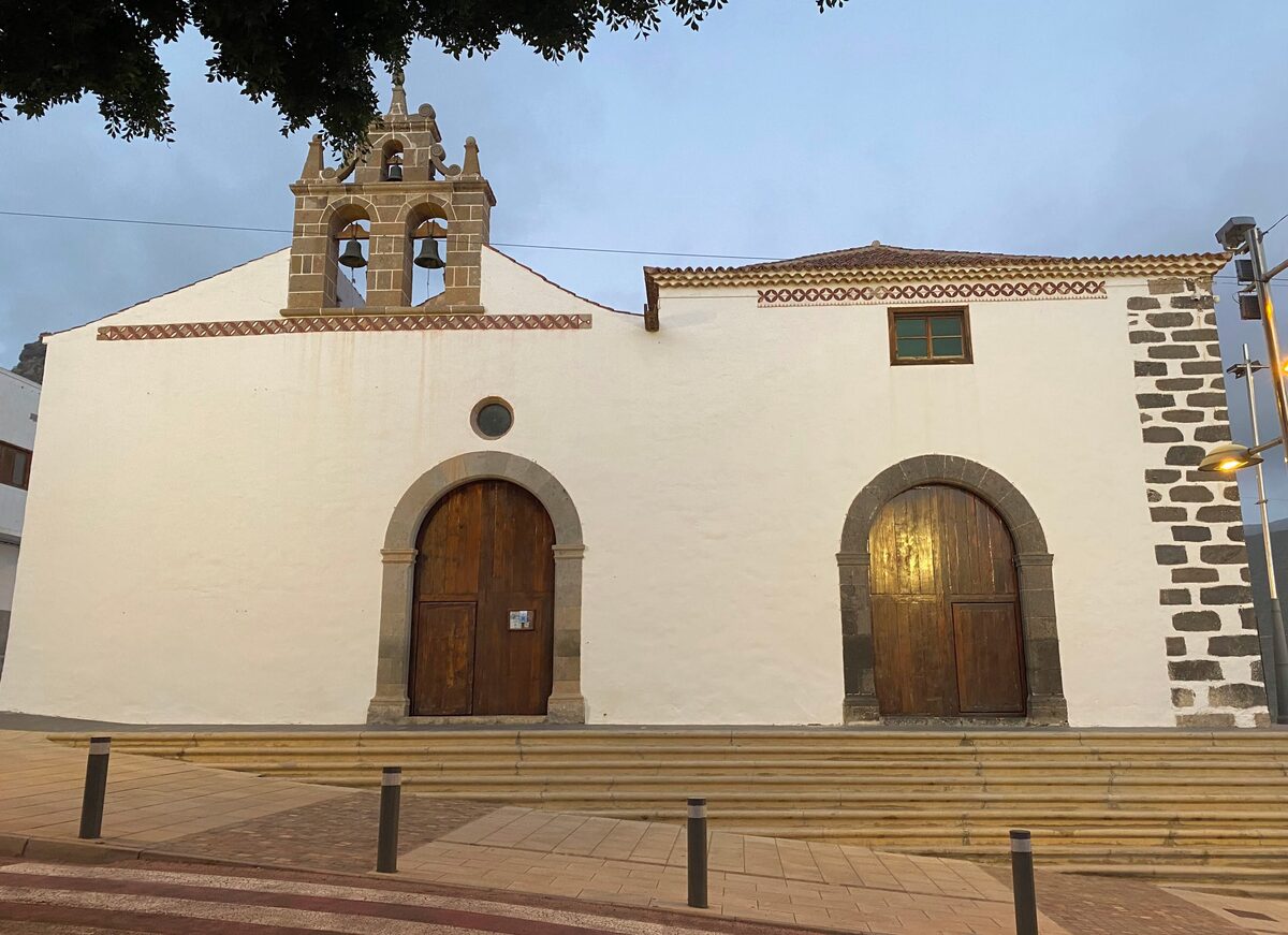 The white Church of Santa Úrsula in Adeje with its small bell gable and arched doors