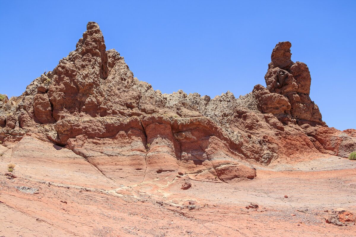 Eroded red rock formations of the Roques de García under a blue sky