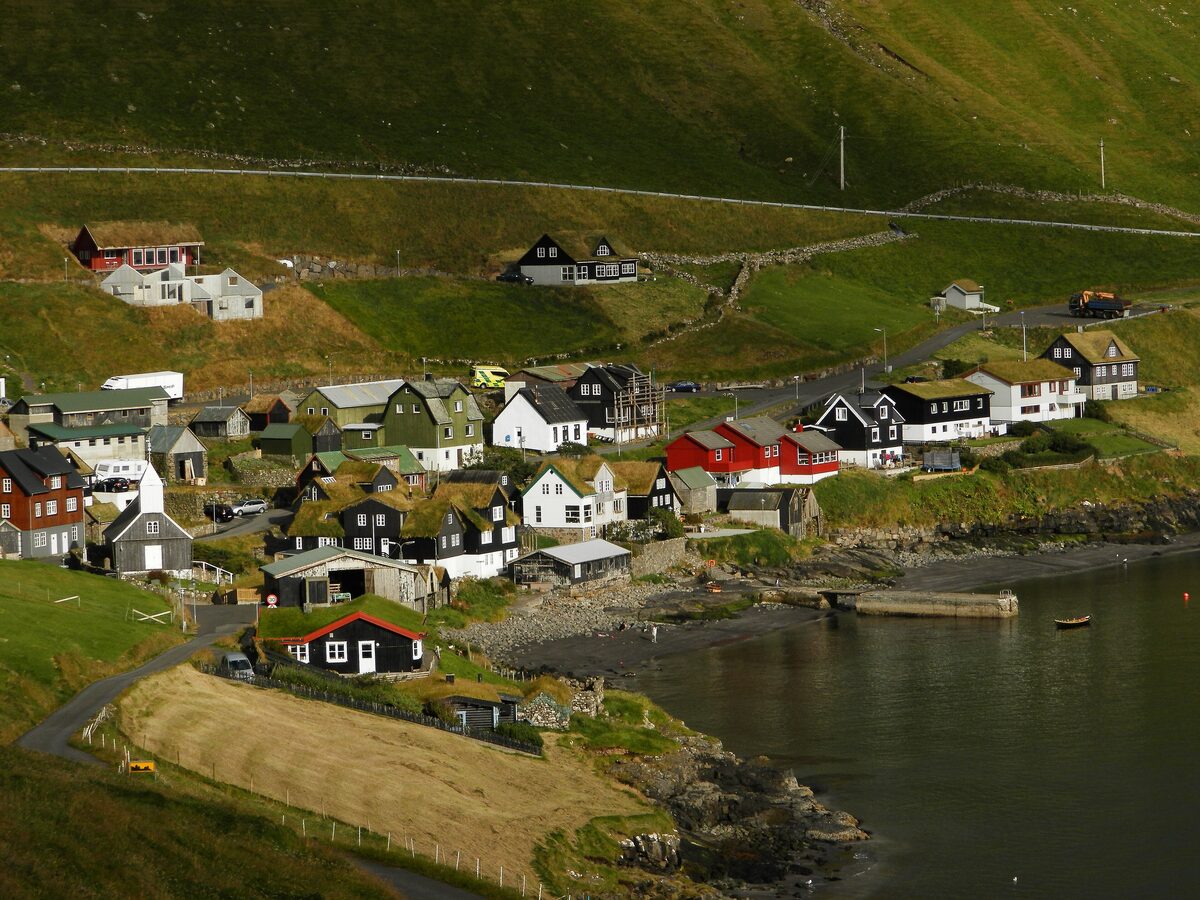 The turf-roofed houses of Bøur, a small village on Vágar by the water