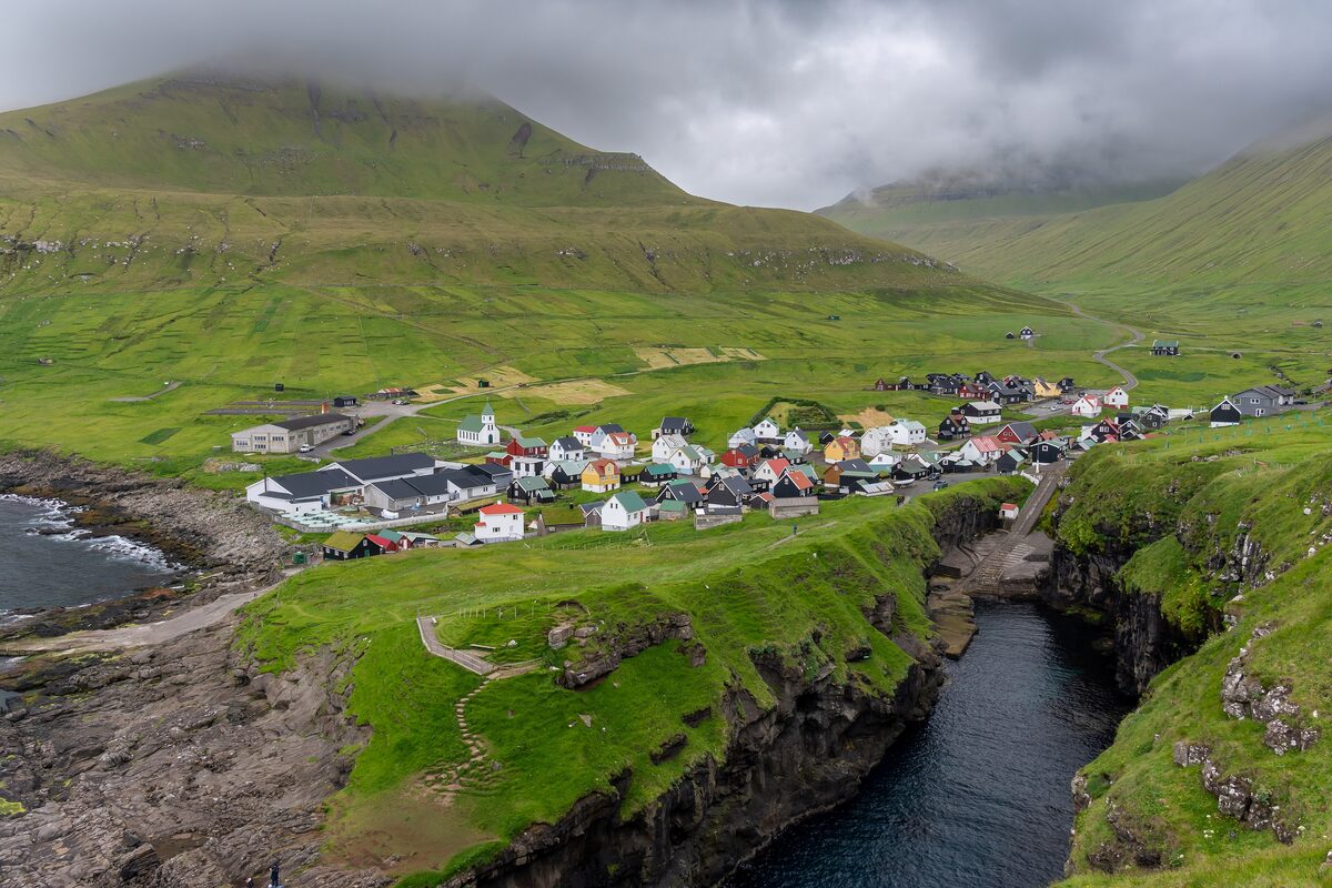 The village of Gjógv above its deep, narrow sea gorge running down to the water
