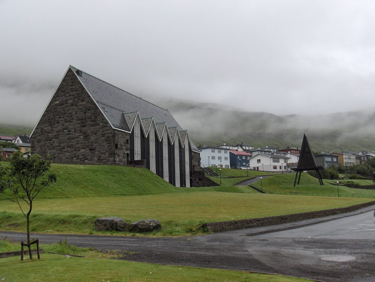 Christianskirkjan in Klaksvík, a stone church with a steep roof in the fog