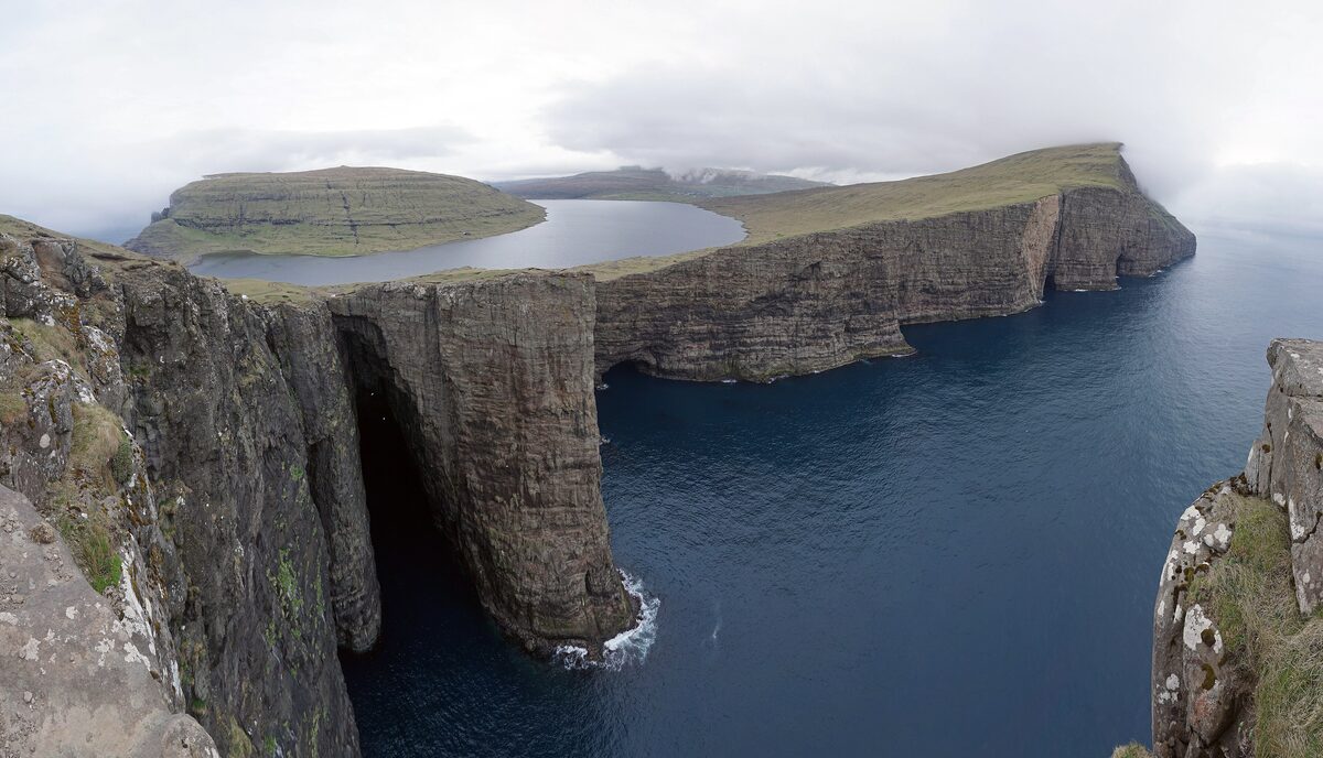 Sørvágsvatn, the lake that seems to hang above the Atlantic, seen from the cliffs at Trælanípa