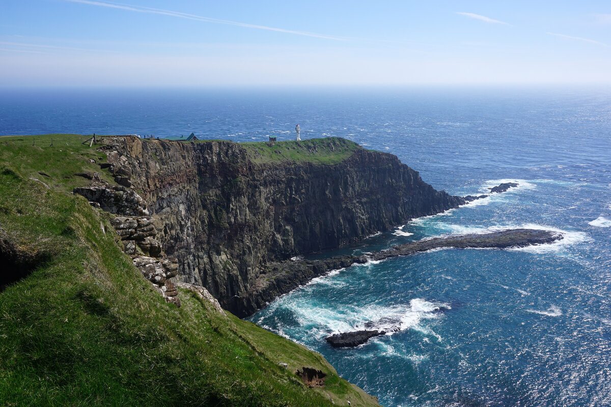 The Akraberg headland at the southern tip of Suðuroy, with its lighthouse on the cliff above the open sea