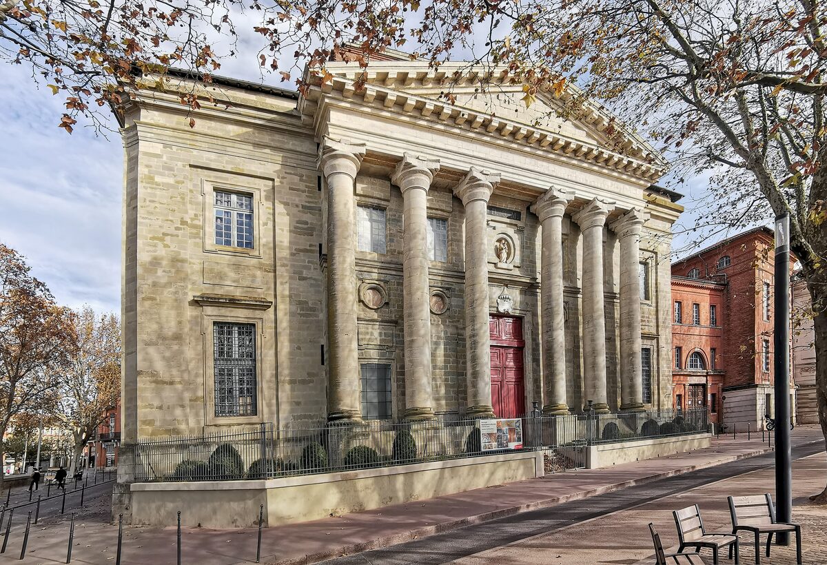 The columned neoclassical facade of the Basilica Notre-Dame de la Daurade in Toulouse