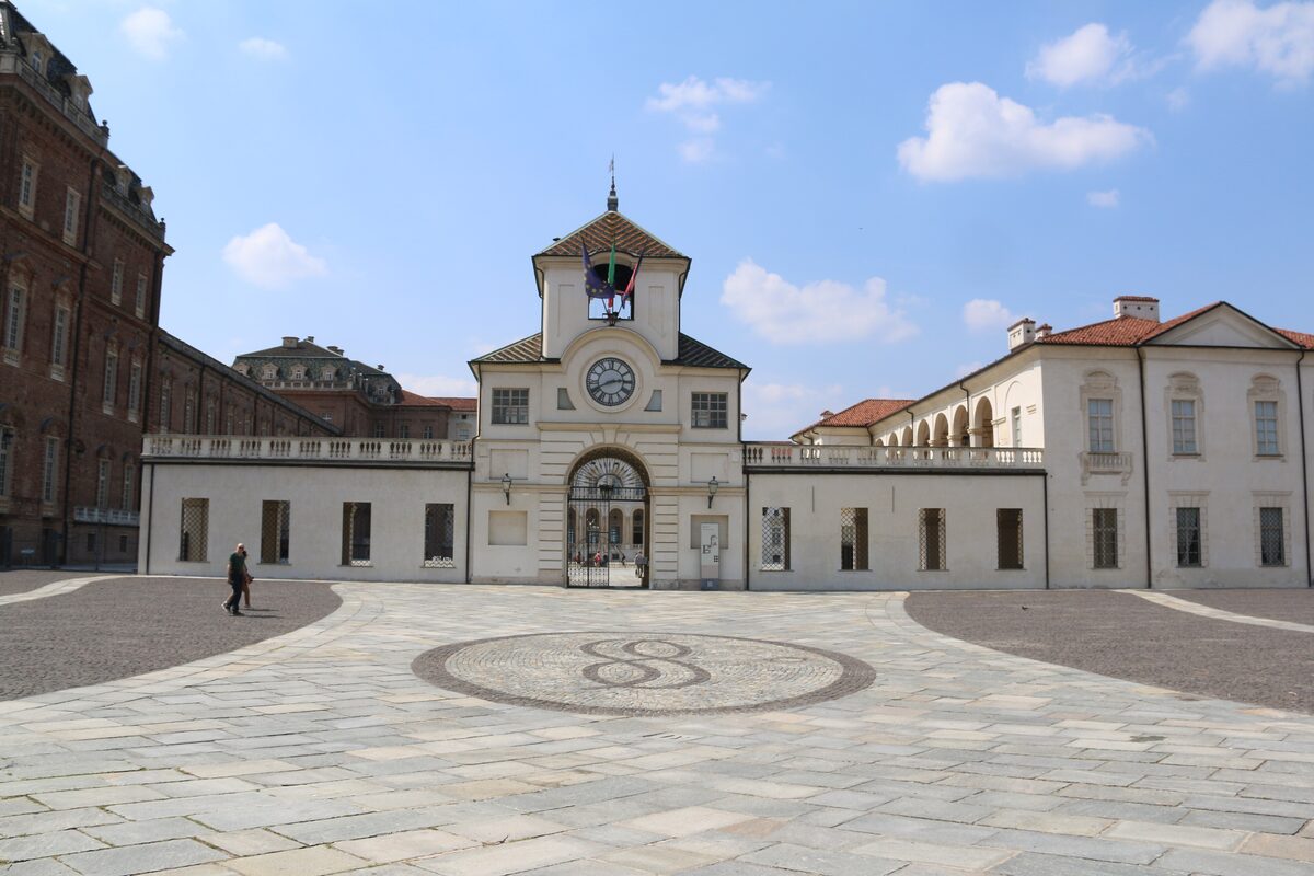 The clock tower and white wings of the Reggia di Venaria Reale