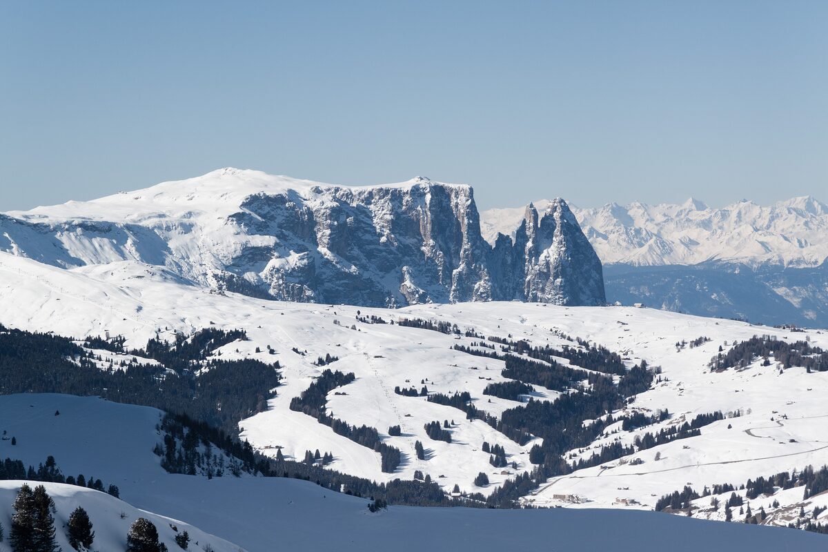 The Schlern ridge rising above snow-covered Alpe di Siusi meadows