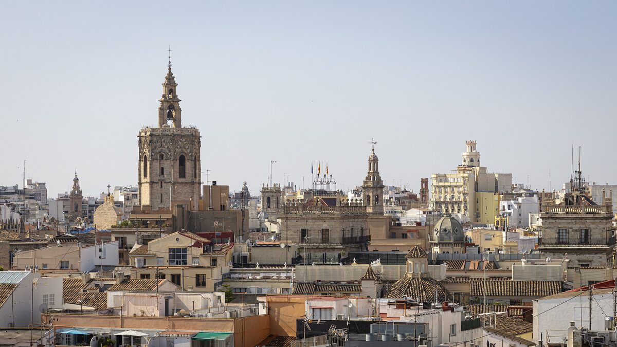 View over the rooftops of Valencia's old town to the Micalet bell tower and church domes, from the Torres de Serranos