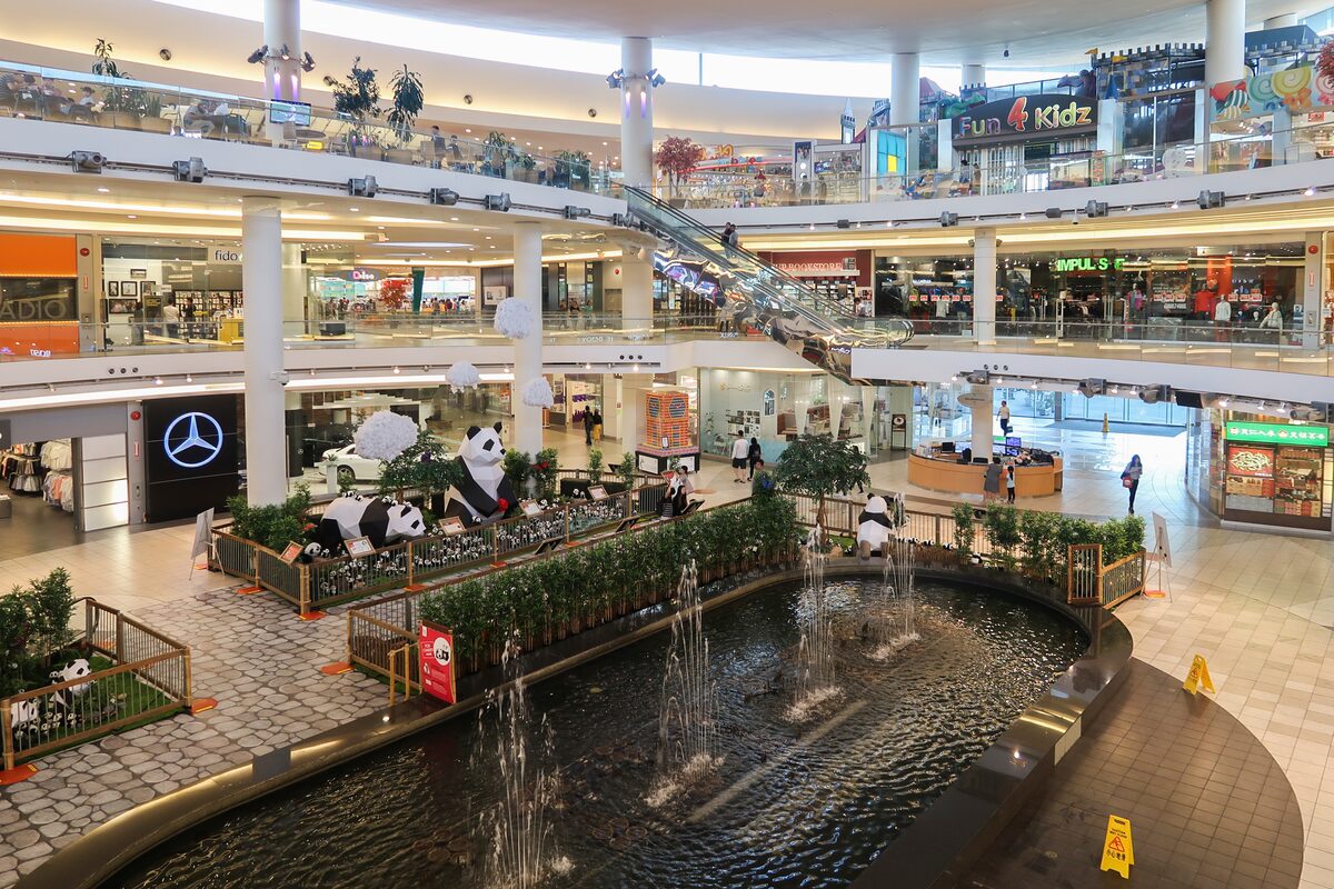 The atrium of Aberdeen Centre in Richmond, with shop levels around a fountain pool and panda sculptures