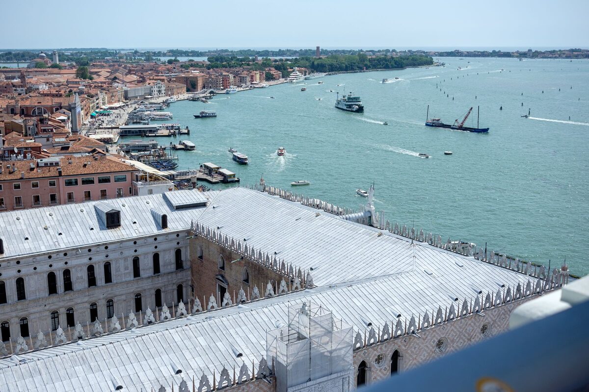 View from the top of the Campanile over the white roof of the Doge's Palace, the lagoon and the waterfront of Castello