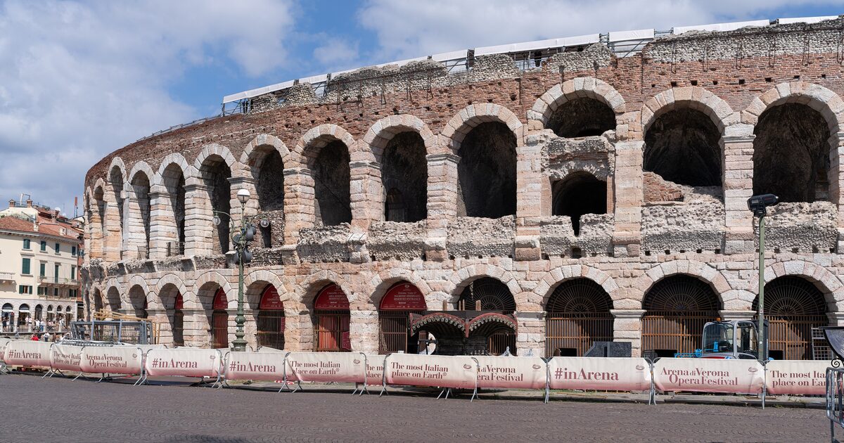 The Roman Arena in Verona seen from Piazza Bra, its stone arches in full sun