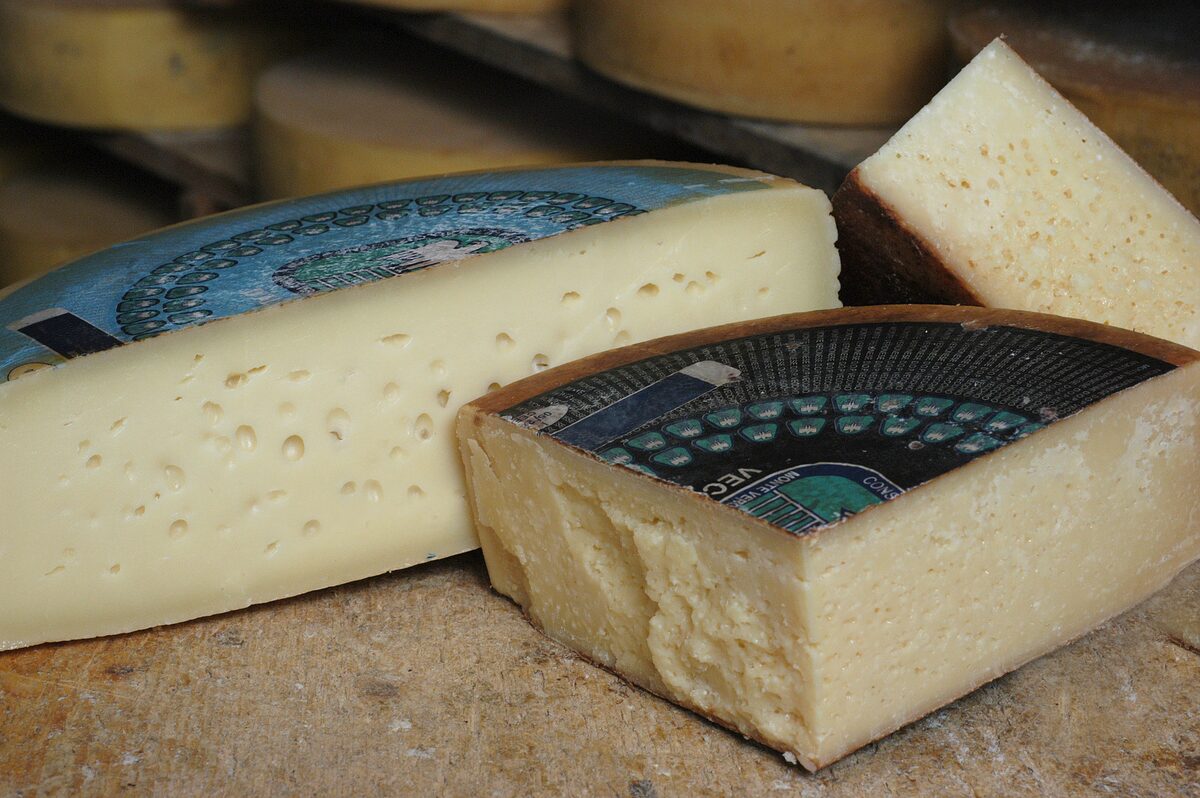 Wheels and wedges of Monte Veronese cheese